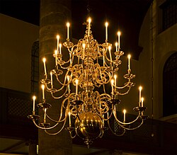 A Dutch brass chandelier with curved arms and a large sphere in the Portuguese Synagogue in Amsterdam