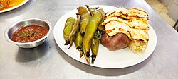 Traditional plato paceño consisting of lima beans, potatoes, white corn and fried cheese.
