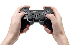 DualShock 3 controller in hand
