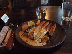 A plate of crocodile meat in teriyaki sauce in Helsinki, Finland