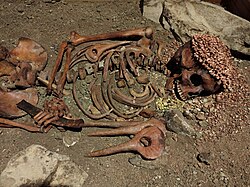 Burial of an adolescent from the Upper Palaeolithic (29,000 years), having led archaeologists to nickname him the "young prince". About fifteen years old, he lay on his back on a layer of red ocher seven meters from the surface facing south, he wore a headgear decorated with shell beads and pierced deer teeth and squirrel tails on the thorax (Liguria region).[12]