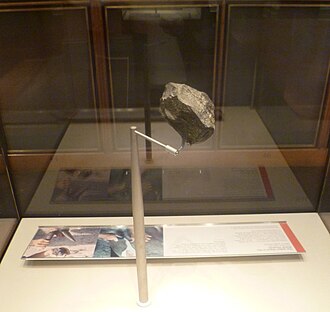 A 1.8-million-year-old stone chopping tool discovered at Olduvai Gorge and on display at the British Museum