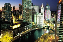 The Chicago Sun-Time press building from the 1950s to the early 2000s was a relatively low and long modernist building along the Chicago River next to the white Wrigley Building. (The Tribune Tower is farther to the right.)