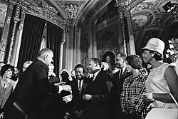 President Lyndon B. Johnson, Martin Luther King Jr., and Rosa Parks at the signing of the Voting Rights Act on August 6, 1965