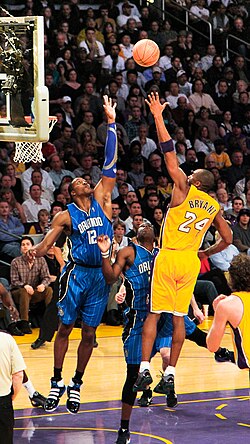 Bryant shoots a left-handed floater over future teammate Dwight Howard of the Orlando Magic in 2010