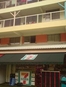 A 7-Eleven shop under a block of flats