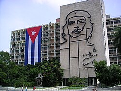 Plaza de la Revolución, in Havana, Cuba. Aside the Ministry of the Interior building where Guevara once worked is a 5-story steel outline of his face. Under the image is Guevara's motto, the Spanish phrase: "Hasta la Victoria Siempre" (English: Until Victory, always).