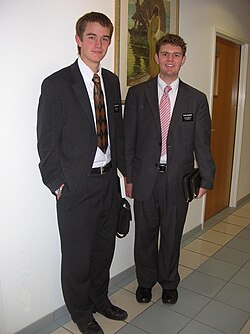 A pair of two young adult male missionaries