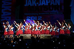 JKT48, a large group in red-and-white costumes
