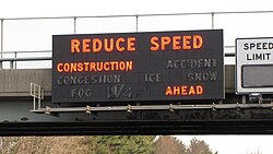 A 1970s variable-message sign displaying a warning about construction ahead. These signs have since been replaced.