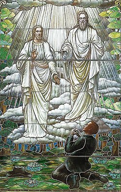 A stained glass window of Joseph Smith's 1820 First Vision