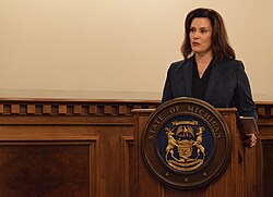Governor Gretchen Whitmer speaking at a National Guard ceremony in 2019