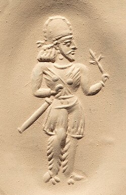 Seal of a Sassanian nobleman holding a flower, c. 3rd–early 4th century AD[157]