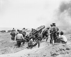 A British 60-pounder (5-inch (130 mm)) gun at full recoil, in action during the Battle of Gallipoli, 1915. Photo by Ernest Brooks.