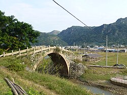 A restored Qing era (1891) bridge on a coastal road