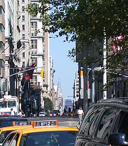 A view of Broadway from Bowling Green with the Chrysler Building in the far background
