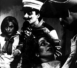 Tobias Haller, Stanley Keyes, Linda Chambers, and James Curran in Brad Mays' production of The Water Hen, by Stanislaw Ignacy Witkiewicz, 1983, New York