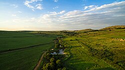 The undulating hills that form part of the rural areas in the province just north of Johannesburg. Although Gauteng is a heavily urbanised province, much of its area is extensively cultivated for agriculture.