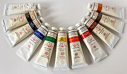 A top view of variously colored tubes of paint.
