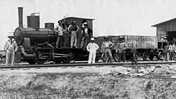 German engineers posed before a locomotive on the newly completed Qingdao–Jinan railway, which opened Shandong's interior to large-scale trade and resource extraction, connecting the port of Qingdao with the provincial capital Jinan and laying the groundwork for the region's rapid urban and industrial transformation