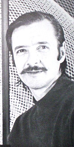 Artist Eduardo Mac Entyre and one of his helixes, c. 1980.