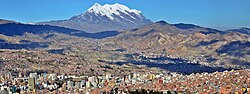 Mount Illimani towering over La Paz. Illimani is considered an apu in Aymara spirituality, a mountain deity and guardian of the city.