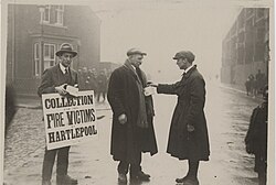 Two men collecting for the victims of The Great Timber Yard Fire in Hartlepool, 1922. Set up by the mayor of Hartlepool the day after the blaze, the fund soon gained popular support from places all over the region, such as Durham and Newcastle, as well as from further afield.