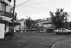 Ribera de San Cosme avenue and Lauro Aguirre street, where the Corpus Christi massacre occurred. The building that was the furniture store and school in the film is now a gymnasium.