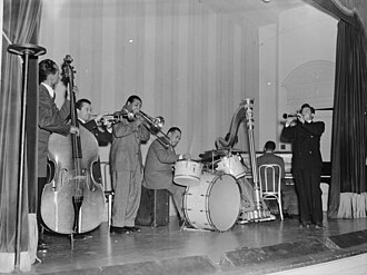 Tommy Potter, Max Kaminsky, Benny Morton, Singleton, Adele Girard, Teddy Wilson, and Joe Marsala, National Press Club, Washington, D.C. in 1939