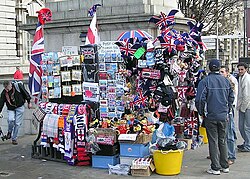 Sellers of souvenirs are typically located in high traffic areas such as this London souvenir stand situated near a railway station on a busy street corner.