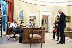 President Barack Obama talks on the phone in the Oval Office with John Kerry regarding the situation in Turkey, 15 July 2016