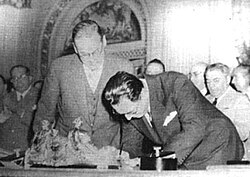 President Juan Perón (right) signs the nationalization of the British-owned railways with Ambassador Sir Reginald Leeper