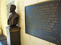 A bust of Joseph Pulitzer and plaque in the Columbia Journalism School lobby