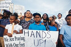 A "Hands up!" sign displayed at a Ferguson protest in August 2014