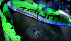 Nike Vaporfly cut in half to show the different layers that make up the base of the shoe. The dark grey line shows the carbon fiber plate.