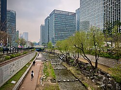 Restored in 2004, walled by high-rise office buildings on both side, standing as an eco-friendly linear park of stream between Jongno District and Jung District, the Cheonggyecheon is a soul of 21st-century Downtown Seoul.