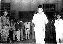 Sukarno reading the Proclamation of Indonesian Independence at Jalan Pegangsaan Timur No. 56, Menteng