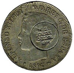 Spanish currency used in the Caroline Islands at the end of the 19th century. Note the German circular punch, made following the Spanish cession of the islands to Germany in 1899.