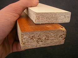 Particle board with veneer