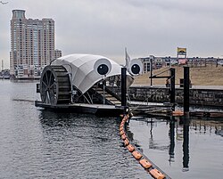 The "Mr. Trash Wheel" trash interceptor at the mouth of the Jones Falls River in Baltimore's Inner Harbor