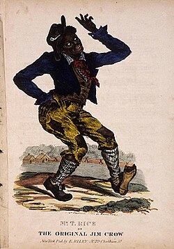 Man in blackface and ragged clothes with shoe worn through, dances with one hand on hip, fingers waving, white of eyes prominent as he looks upward.