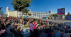 People in Pyongyang watch Kim Jong Un on North Korean TV, 2015