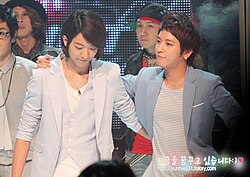 Bassist Lee and frontman Jung in midst of filming M Countdown, 2010