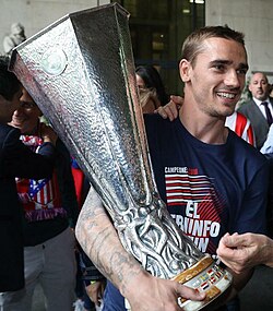 Antoine Griezmann, Atlético's all-time top scorer, with the UEFA Europa League trophy in 2018