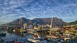 Cape Town's CBD and Table Mountain, viewed from the V&A Waterfront. The city is South Africa's tourism capital and a leading tech hub on the continent.[255]