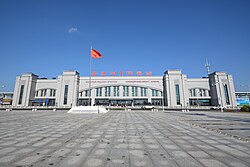 Hunchun Railway Station, with signage in Chinese, Korean, Russian, and English