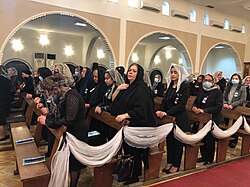Chaldean Catholics praying in a Holy Qurbana in Baghdad, Iraq.