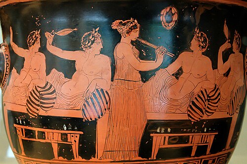 Banqueters playing Kottabos and a girl playing the aulos, Greece (c. 420 BCE). Banqueting and music have continued to be two important entertainments since ancient times.