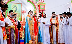 Picture of the clergy wearing their different vestments