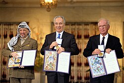 Yasser Arafat, Shimon Peres and Yitzhak Rabin receiving the Nobel Peace Prize following the Oslo Accords, 10 December 1994